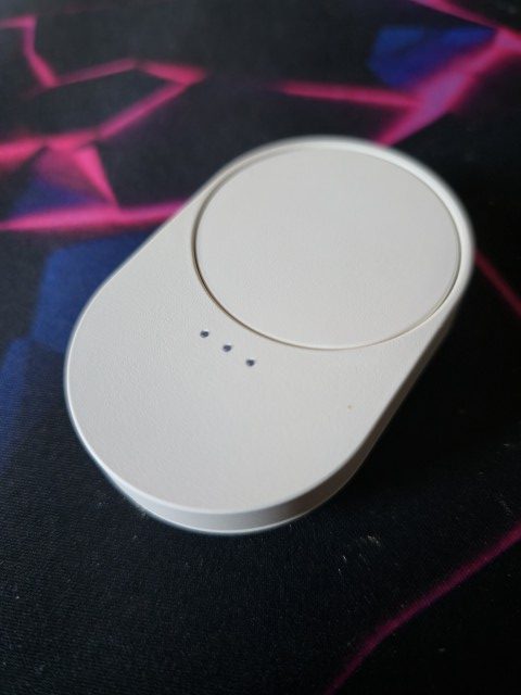A Bilresa scrollwheel remote from Ikea, on a dark background